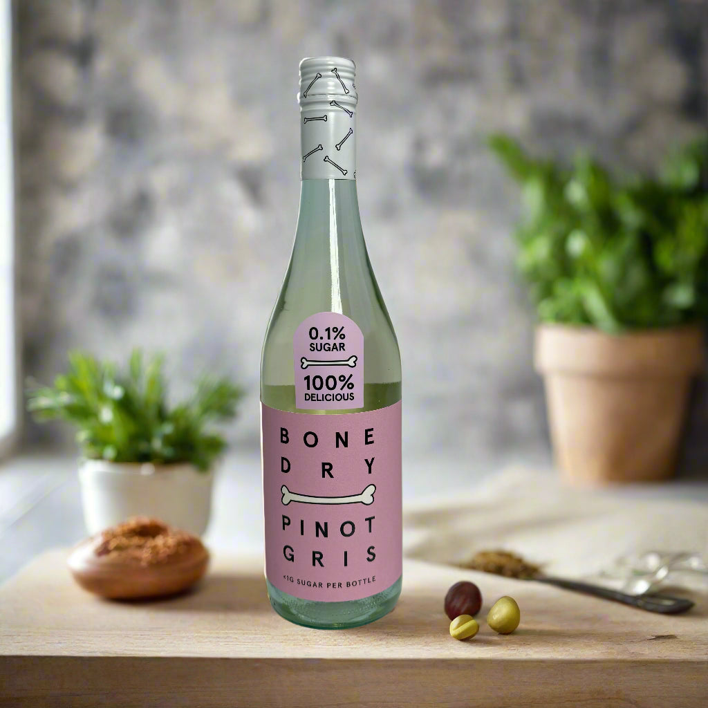 Bottle of Bone Dry Pinot Gris with a pink label on a gray background