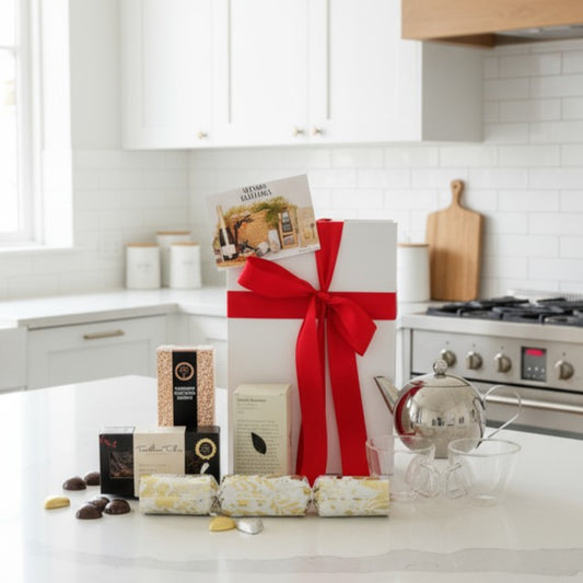 Christmas Tea Bliss gift with stainless steel teapot, glass teacups, Christmas tea and festive treats by Cadeau + Bliss.