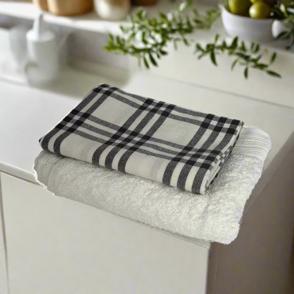 Folded plaid towel on a white cabinet